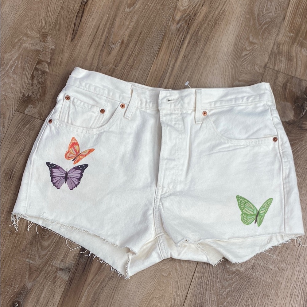 Levi's White Jean Shorts with Distressed Hem and Butterfly Appliqués